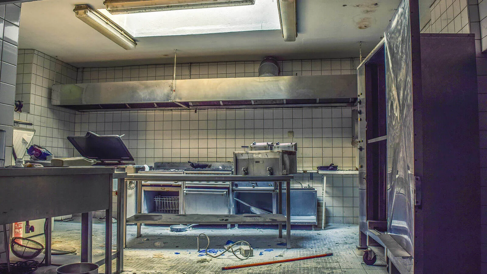 Old kitchen before remodeling with industrial features.